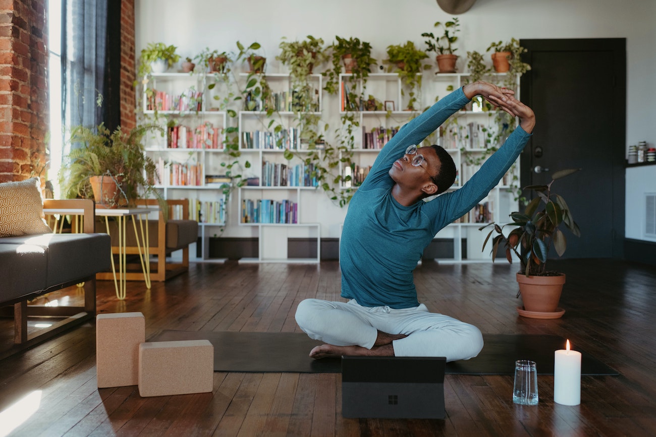 Person stretching on a yoga mat